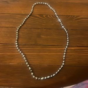 Silver colored beaded plastic necklace